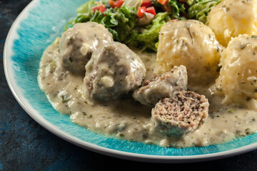 Meatballs with creamy and cheese gravy served with mashed potatoes
