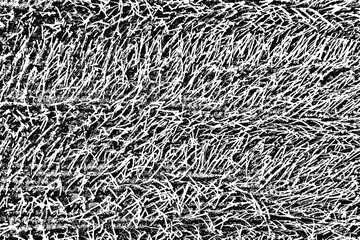 Grunge texture of a fleecy fabric similar to grass. Uneven surface with noise, grit. Vector illustration. Overlay template.