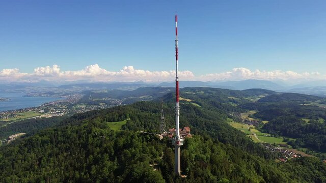 Uetliberg mountain and communication tower overlooking the city and lake of Zurich in Switzerland on a sunny summer day. 