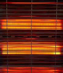 infrared heating elements of an electric heater with protective grid