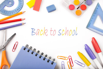 Children education,accessories,school supplies,colored pencils and a notebook of trendy colors on white background for design.The concept of school children's creativity and Back to school concept.