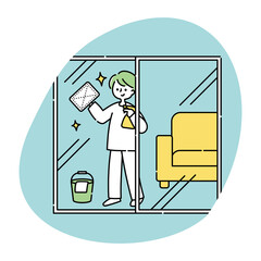 窓拭きをする男性