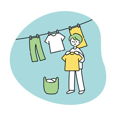 洗濯物を干す男性