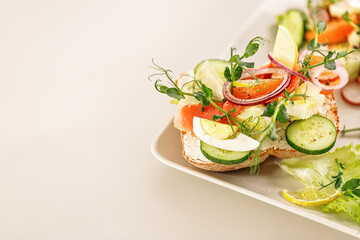 Quick and healthy food recipes. Salad with salmon, vegetables and herbs on Italian ciabatta bread. Mediterranean dish recipes. Selective focus. Copy space