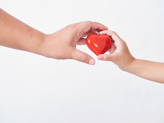 Heart in child and mother hands