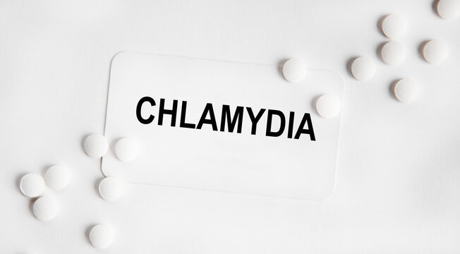 On the card text CHLAMYDIA , next to the white tablets.