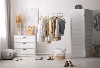 Dressing room interior with stylish white furniture