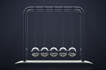 Resting newton's cradle. Close-up. Low key.