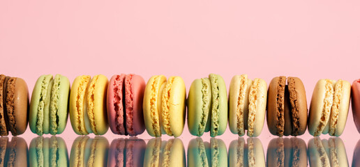 Colorful french macarons on background