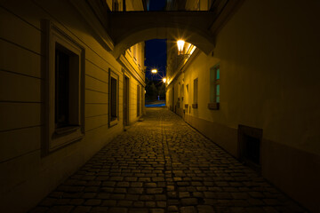 Fototapeta premium Night street of old Prague Under the light of lanterns