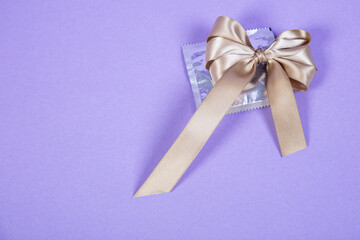 ribbon lies on the condom, surprise and intercourse concept