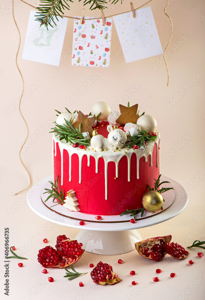 Sticker Christmas or New Year decorated cake with cream cheese frosting and cranberries, selective focus