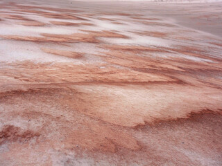 Colored sand in the snow. Artistic noise