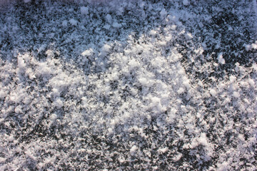 Texture of the snow on the ice. Winter natural background