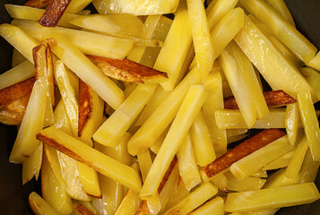 Fried sliced potatoes. Top view. Close-up