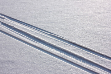 Skiing track in snow. Winter natural background