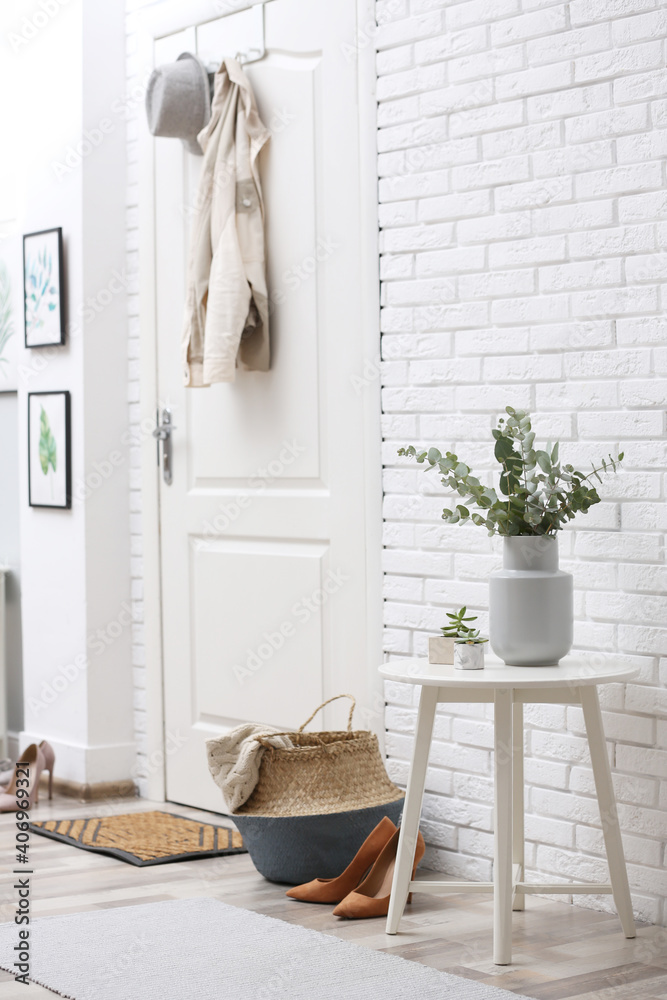 Canvas Prints Vase with fresh eucalyptus branches on table in entryway. Interior design