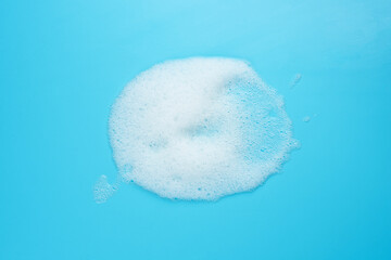 Foam bubble drop on blue background on top view object beatuy health care concept design