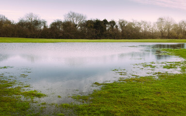 Flooding and poor drainage on open pasture after heavy rain in Beverley, Yorkshire, UK.
