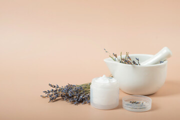 body cream with lavender on a beige background.