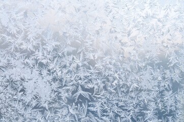 Cold frost patterns on window glass. Winter texture