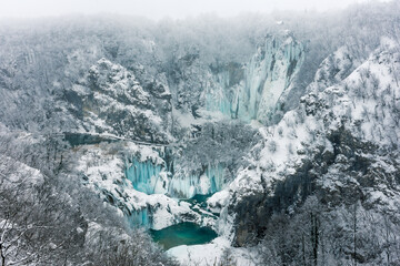 Frozen waterfalls and snow in Plitvice National Park in Croatia