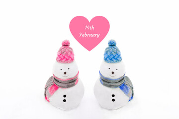 Snowmen wearing winter hat, scarf on a white isolated background in pink and blue colors.Valentins day, boys and girls, love concept.