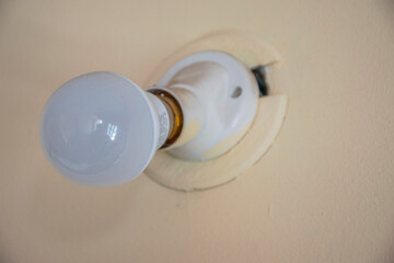Picture of new age LED bulb installed on wall.