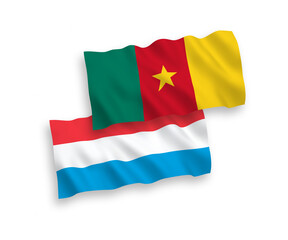 National vector fabric wave flags of Cameroon and Luxembourg isolated on white background. 1 to 2 proportion.