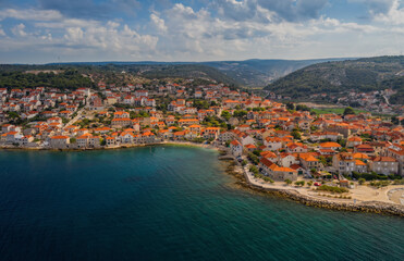 Fototapeta na wymiar Aerial panoramic drone view on village Postira on Brac island, Croatia. August 2020