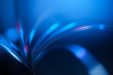 futuristic blurry abstract background in blue and red cinematic tones. strings, strips of arcs and...