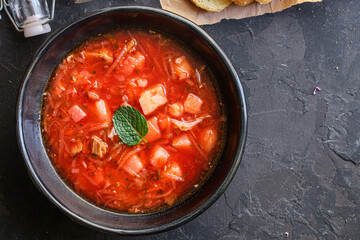 borscht red tomato soup first course bouillon meat and vegetables on the table meal snack keto or paleo diet
outdoor top view copy space for text food background rustic image 