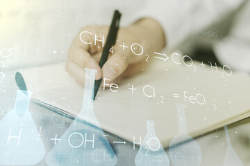 Creative chemistry illustration with man hand writing in diary on background, science and research concept. Multiexposure