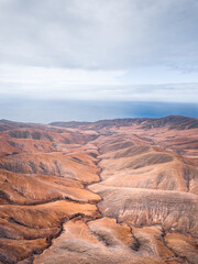 Fototapeta na wymiar Fuerteventura Mountains and Coastline Aerial View