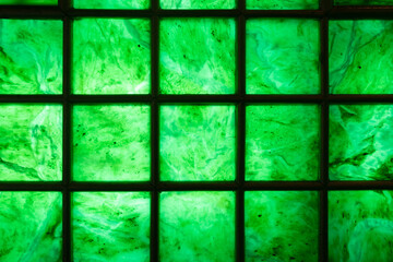 close up view of jade stone wall with steel grille background or texture