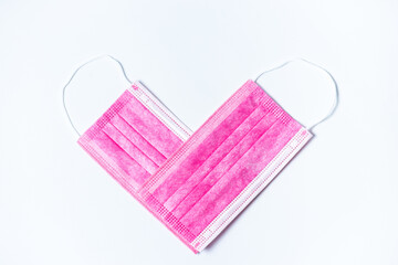 Protective mask in the shape of a heart on a white background
