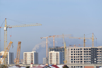 Fototapeta premium construction, crane, building, architecture, sky, build, site, house, industry, tower, development, business, structure, work, city, concrete, blue, new, buildings, urban, engineering, cranes, apartme