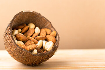 Almonds, cashew nuts in bowl close up. Vegan protein source, copy space