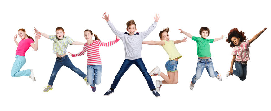Joyful Multiracial Kids Jumping In Mid-Air Posing Over White Background