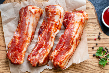 ribs raw tomato sauce grill bbq marinated barbecue pork meat fresh meal snack outdoor top view copy space for text food background rustic image