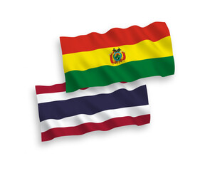 National vector fabric wave flags of Bolivia and Thailand isolated on white background. 1 to 2 proportion.