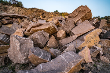 Stone materials near old flooded stone quarry