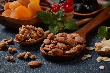 Mix of dried and sun-dried fruits,  in a wooden trays . View from above. Symbols of the Jewish holiday of Tu BiShvat