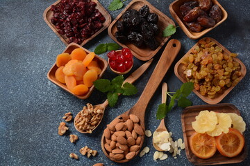 Mix of dried and sun-dried fruits,  in a wooden trays . View from above. Symbols of the Jewish holiday of Tu BiShvat