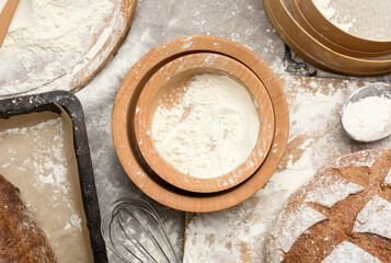 wooden plates with the remains of white wheat flour
