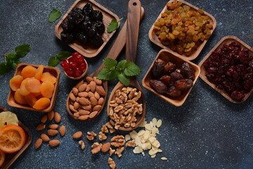 Mix of dried and sun-dried fruits,  in a wooden trays . View from above. Symbols of the Jewish holiday of Tu BiShvat