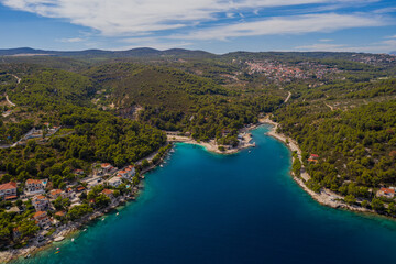 SUMARTIN, CROATIA - august 2020: Aerial drone panorama of the quiet harbor, Brac Island east side on a summer morning.