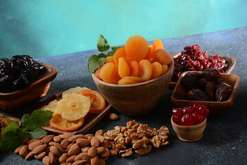 Mix of dried and sun-dried fruits,  in a wooden trays . View from above. Symbols of the Jewish holiday of Tu BiShvat