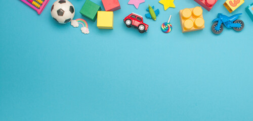 Horizontal banner of kids toys on blue background
