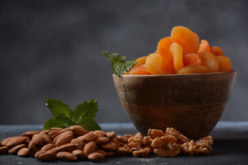 Mix of dried and sun-dried fruits,  in a wooden trays . View from above. Symbols of the Jewish holiday of Tu BiShvat
